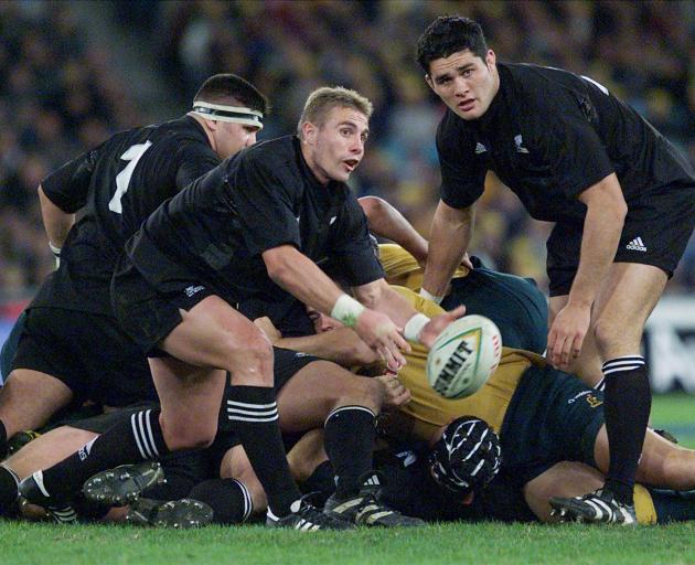 Justin Marshall clears from a ruck during the first Tri-Nations test in Sydney in 2000. Photo:...