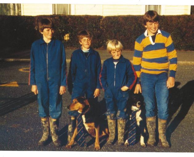 Matt Chisholm (second from right) with brothers Aaron, Nick and Dean and dogs Rock and Tip. Photo / Supplied