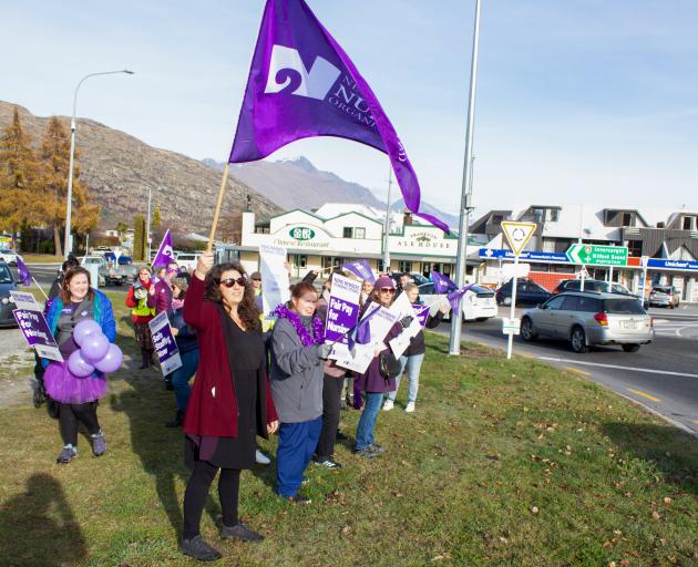 Nurses from Queenstown’s Lakes District Hospital protest at the Frankton roundabout yesterday....