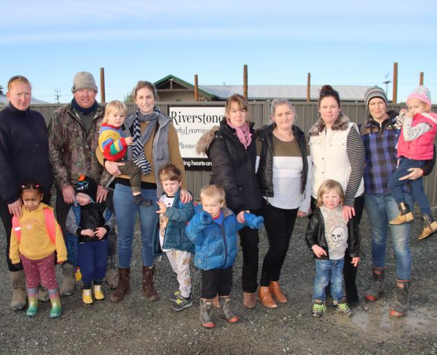 Some of the Riverstones Early Learning Centre parents and children who will be affected when it...