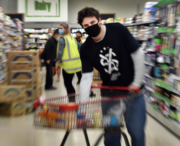 Student Volunteer Army Otago logistics officer Tom Yates shops for a client at New World Centre...