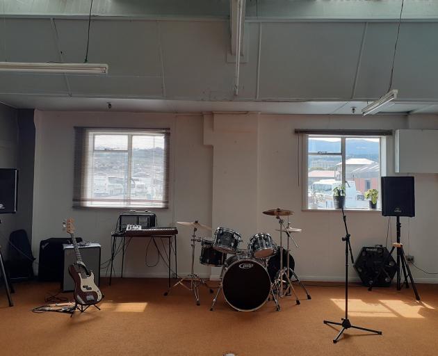 A practice room in Spaceland. Below, the inaugural gig. PHOTOS: SUPPLIED