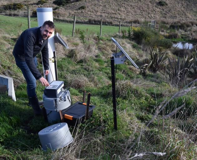 AgResearch Invermay senior scientist Richard Muirhead programmes an automatic water sampler in a...