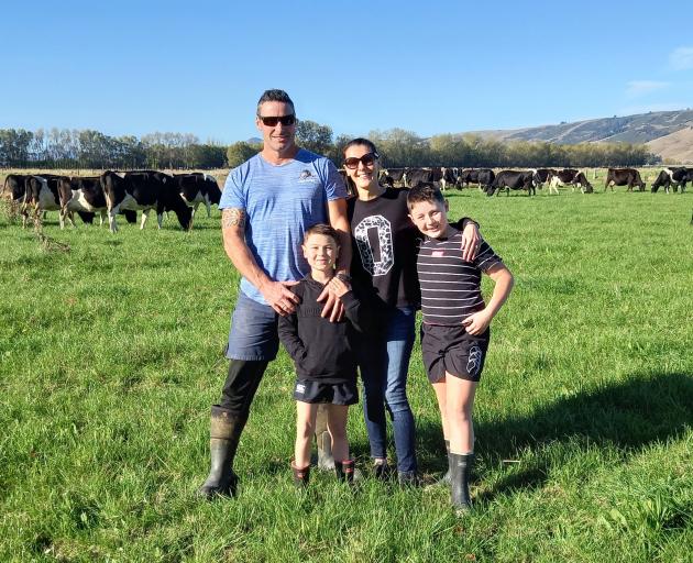 Taieri dairy farmers James and Celia Aitken, with their sons Carlos (left) and Harvey, are on...