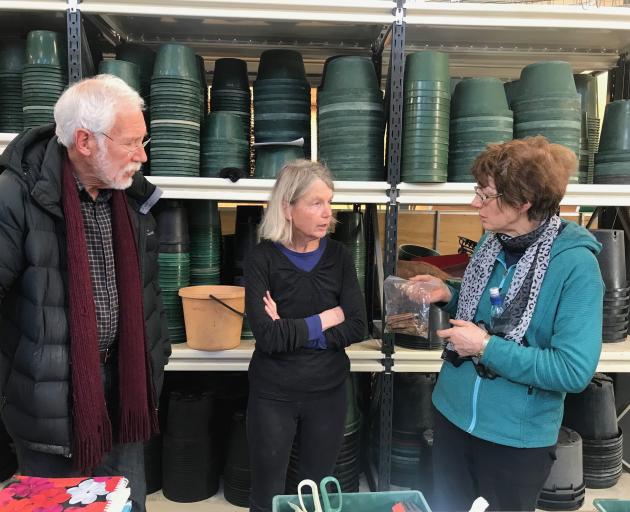 Dunedin Botanic Garden senior staff member Alice Lloyd-Fitt (centre) gives tips on propagation to...
