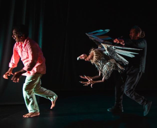 Jacob Rajan (left) is pursued by a spectacular vulture puppet created by Jon Coddington (right)...