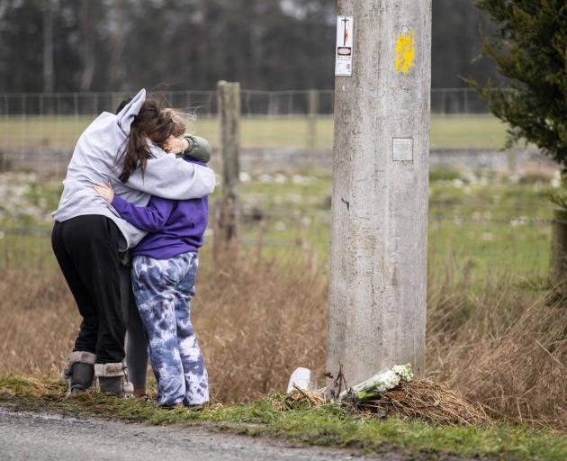 Friends of the victims have been gathering at the crash scene. Photo: George Heard