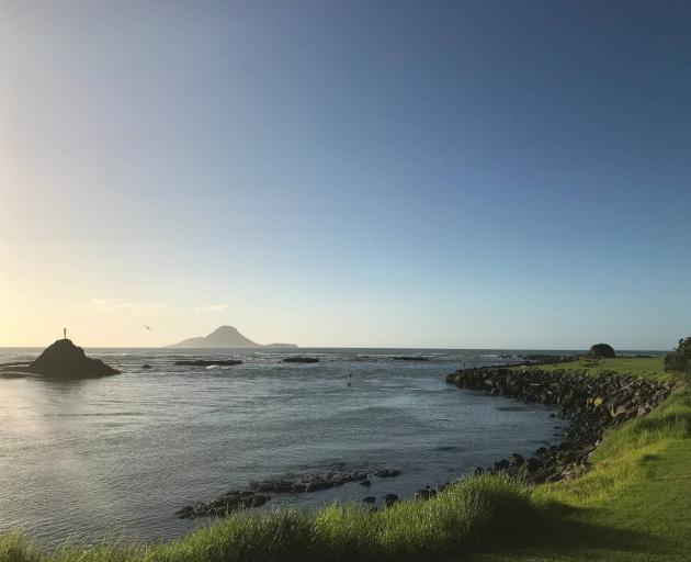 Turuturu Rock in Whakatane, Moutohora/Whale Island in the distance. 