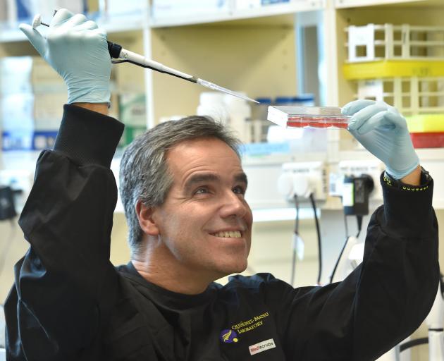 Prof Miguel Quinones-Mateu, of the University of Otago, prepares a wastewater sample for testing...