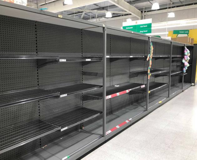 Empty shelves at Countdown Christchurch Airport on Thursday. Photo: Hamish Clark