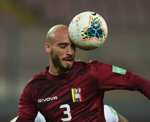 Venezuela defender Mikel Villanueva heads the ball during a World Cup qualifier against Peru in...