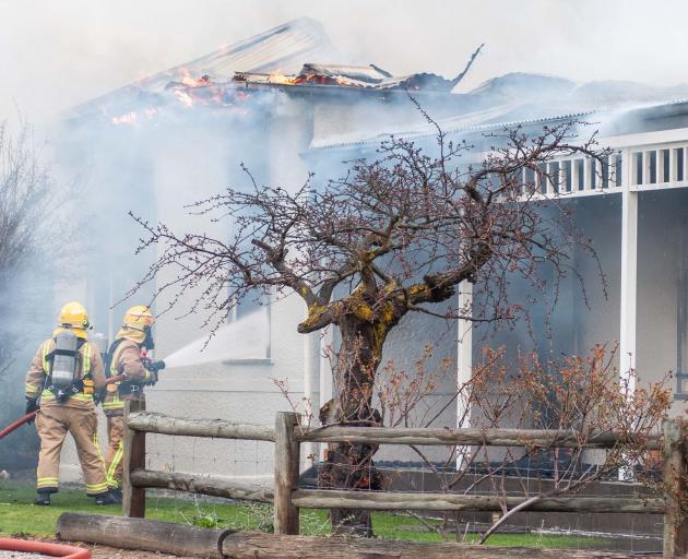 Fire crews fight to keep the blaze at the The Bank Ophir bed and breakfast under control...