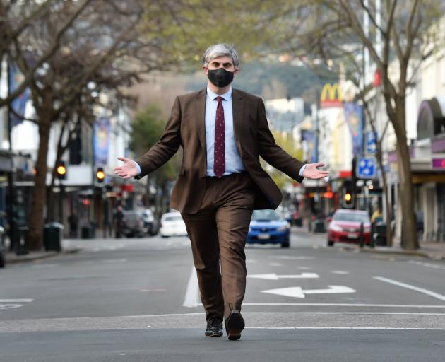 Embracing a one-way future for George St is Dunedin Mayor Aaron Hawkins, approaching the Octagon...