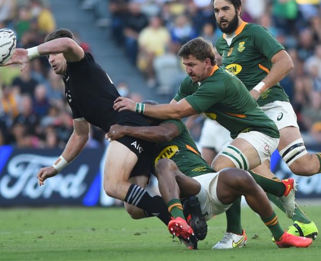 Beauden Barrett delivers an offload during the All Blacks win over South Africa on Saturday....