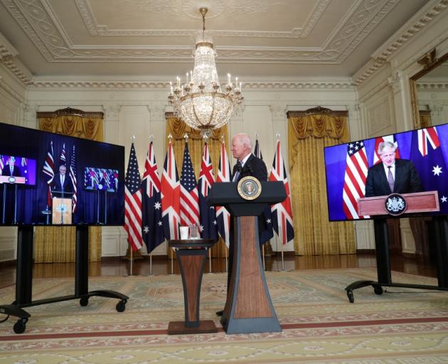 US President Joe Biden at the White House was joined virtually by Australian Prime Minister Scott...