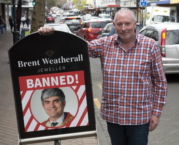 Brent Weatherall, a George St retailer, makes clear how he feels about the Dunedin City Council’s...