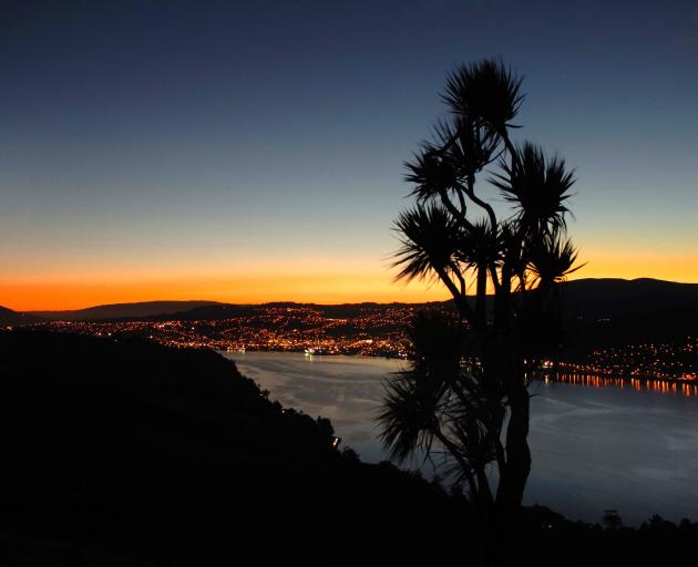 Dunedin city basks in a the red glow of high-pressure sodium lights in a view from Highcliff Rd...