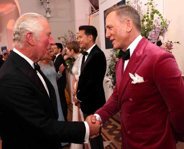Prince Charles talks with actor Daniel Craig at the world premiere of the latest Bond film at the...