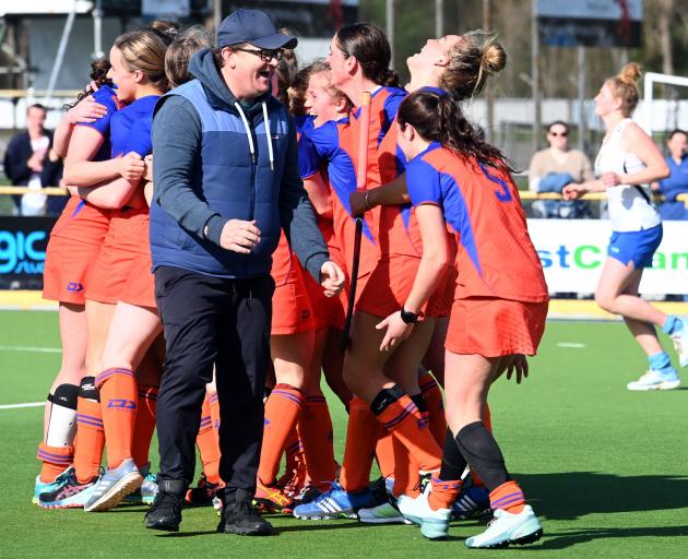 City Highlanders players celebrate with coach Ben Varkalis after their dramatic win in the Otago...