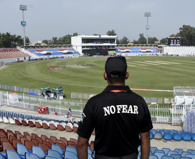 A member of the Police Elite Force stands guard at the Rawalpindi Cricket Stadium, after the New Zealand cricket team pulled out of a Pakistan cricket tour over security concerns. Photo: Reuters