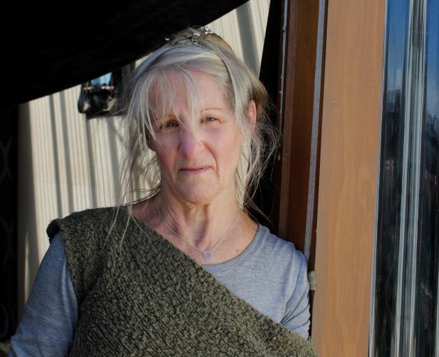 Carol Cudby Robinson has sealed cracks in her doors and windows to keep the smell of coal out of...