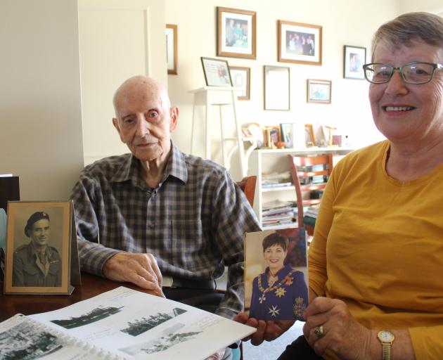 Les King, of Winton, and his daughter Judith Smart, of Ashburton, look over family photos and Mr...