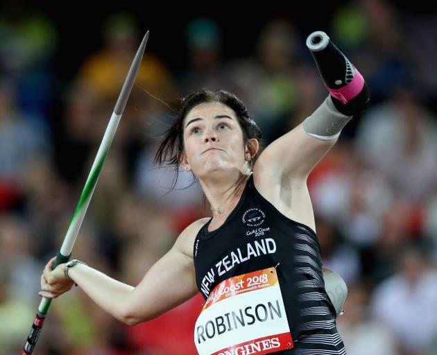 Holly Robinson hurls the javelin to a silver medal at the 2018 Commonwealth Games on the Gold...