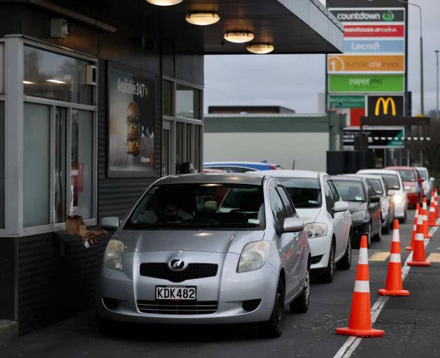 Burger lovers queue at McDonald's in Linwood. Photo: George Heard