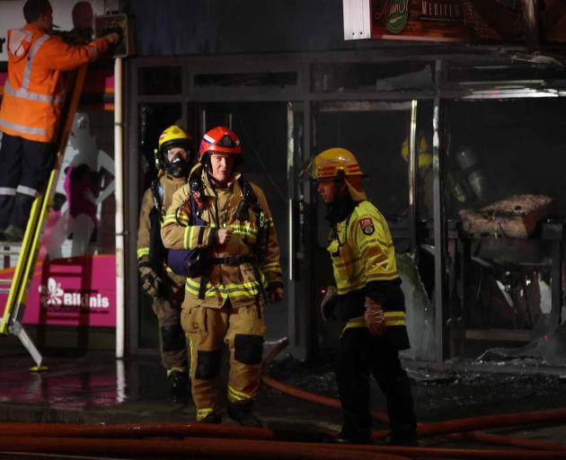 A block of shops on Colombo St has been badly damaged by fire. Photo: George Heard