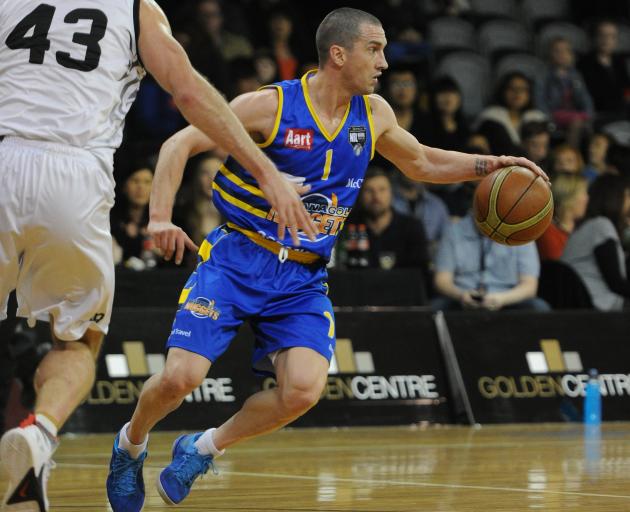Otago Nuggets point guard Mark Dickel assesses his options during a National Basketball League...