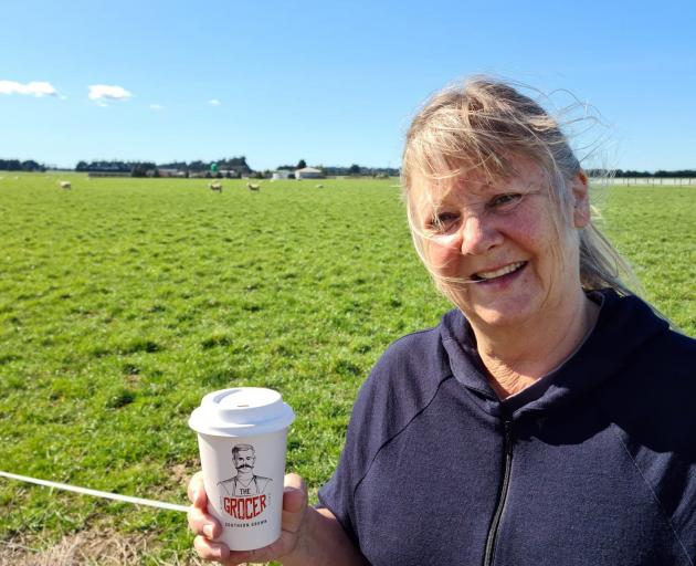 National Invercargill MP Penny Simmonds with a coffee from Woodlands Butchery.