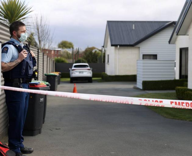 Police stand guard at the scene of the Timaru triple homicide. Photo: George Heard/NZ Herald