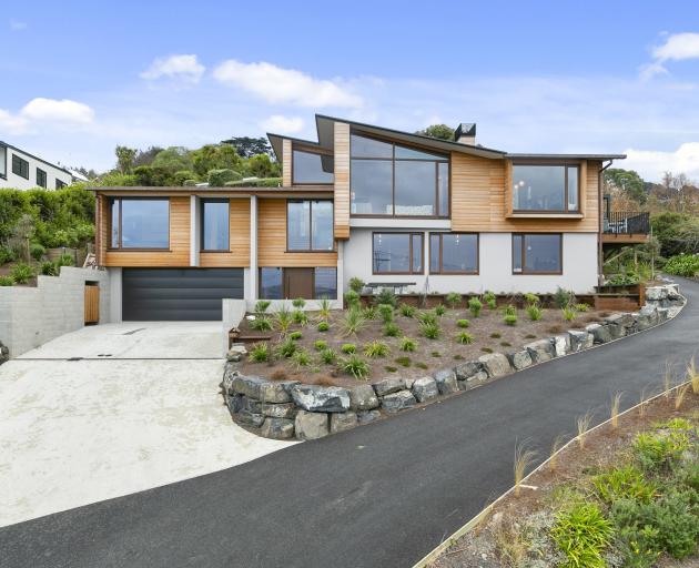 This Dunedin home was designed to capture views of St Clair beach but sit below the view line of...