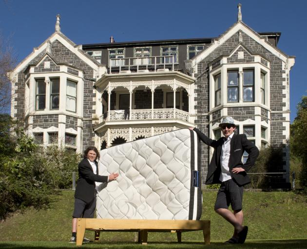 Showing off one of the beds sold to students in Dunedin by The FlatPack are Bryn Fredheim (left)...