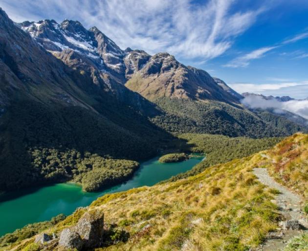 Guided views for the vaxxed: Views like this, from the Routeburn Track of Lake Mackenzie, will...
