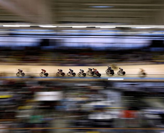 Riders compete in the women's madison final at the track cycling world championships in Roubaix,...