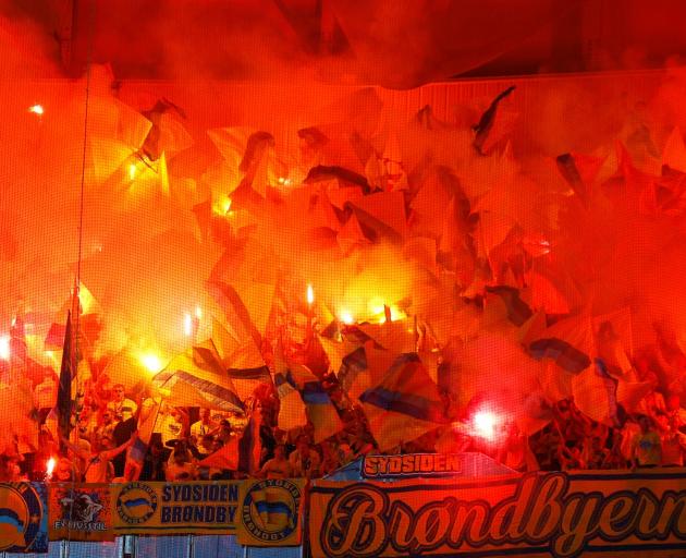  Brondby fans let off flares before their team’s Europa  League clash against Lyon in Lyon...