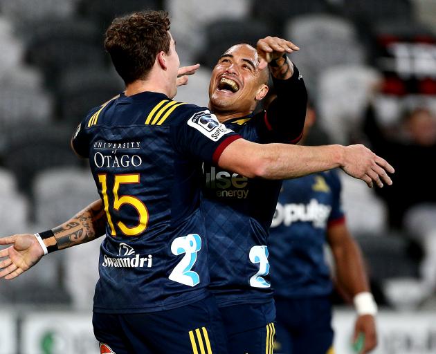 Highlanders co-captain Aaron Smith (right) celebrates with team-mate Josh McKay during a Super...