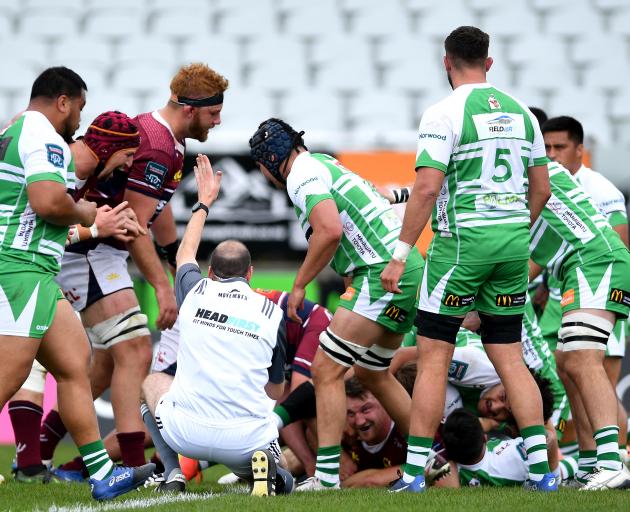 Referee Jono Bredin awards a try to Tony Lamborn, of the Southland Stags, in their NPC match...