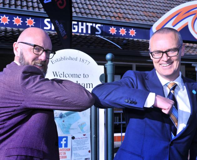 Dunedin MP Dr David Clark (right), then the health minister, celebrates the opening of a Covid-19...
