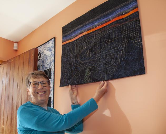 Maria Rohs with her prize-winning quilt, 'Night View at Sunset'.  Photo: Geoff Sloan