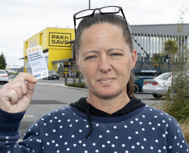 Jody Devine with her mask exemption card. Photo: Geoff Sloan