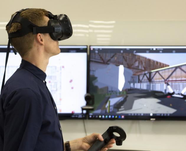 An architect uses the 3-D building information modelling technology. PHOTO: WARREN AND MAHONEY
