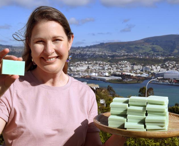 Melissa Parker Bentley displays some of her all-in-one shampoo, conditioner and body wash bars....