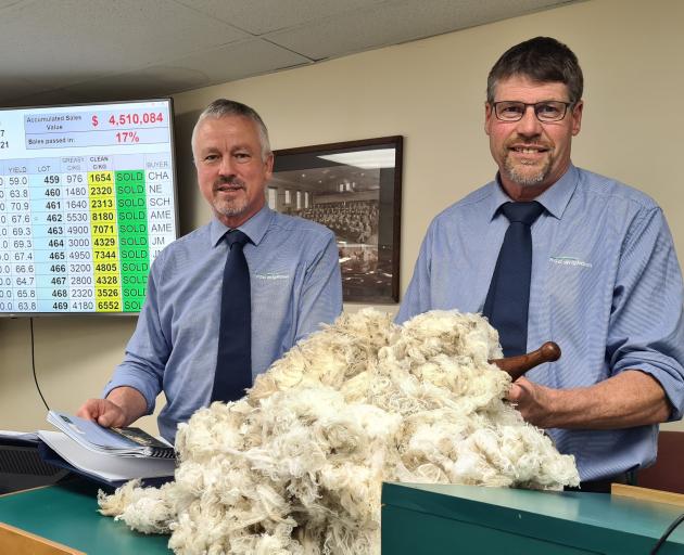 PGG Wrightson South Island auction manager Dave Burridge (left) and auctioneer Doug McKay with 13...