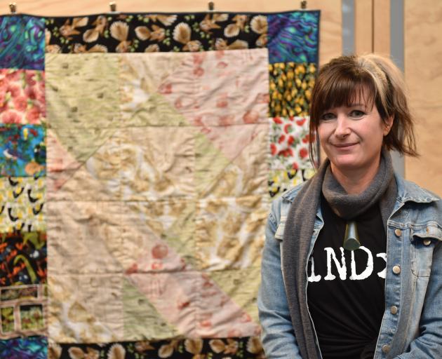 Dunedin autistic artist Tanea Paterson shows her mother’s Christmas present, a knee quilt which...