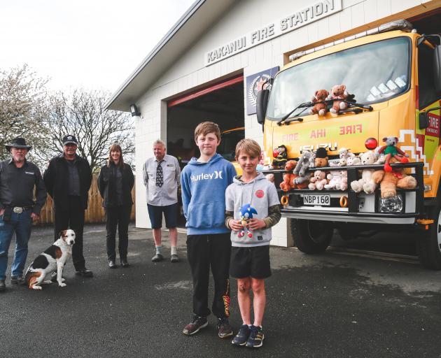 Kakanui brothers Jay (12, front left) and Neiko (8) Thomson donate their Sonic the Hedgehog toy...