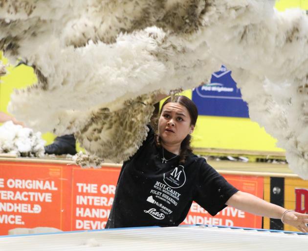 Anahera Cannell, of Alexandra, throws the fleece in a woolhandling heat at the Waimate Shears at...