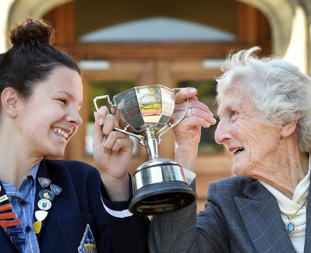 Holding up the Anna P Logan Stout Challenge Cup is Otago Girls’ High School head girl Jemma...