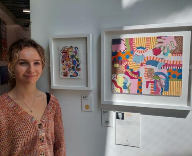 Ella Ward, 19, with her work at the Art Stars exhibition. Photo: Pearl Massie.